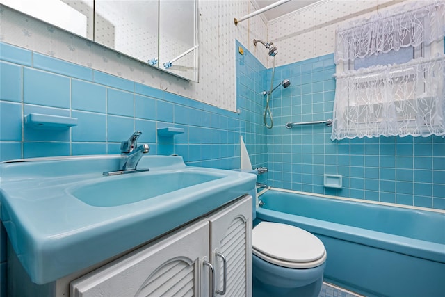245 E Seaman Ave, Freeport, NY 11520 - full bath with wallpapered walls, shower / tub combination, vanity, and tile walls