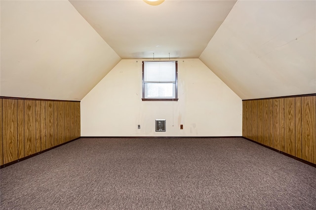 245 E Seaman Ave, Freeport, NY 11520 - additional living space with wood walls, vaulted ceiling, and carpet flooring