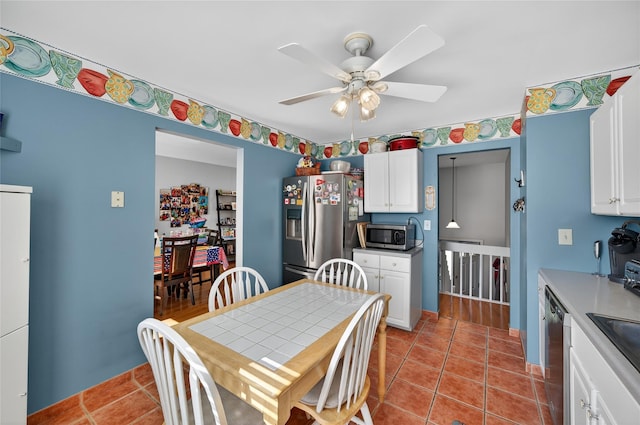 3 Stanford Dr, Highland Mills, NY 10930 - kitchen featuring stainless steel appliances, a ceiling fan, white cabinetry, tile patterned floors, and light countertops