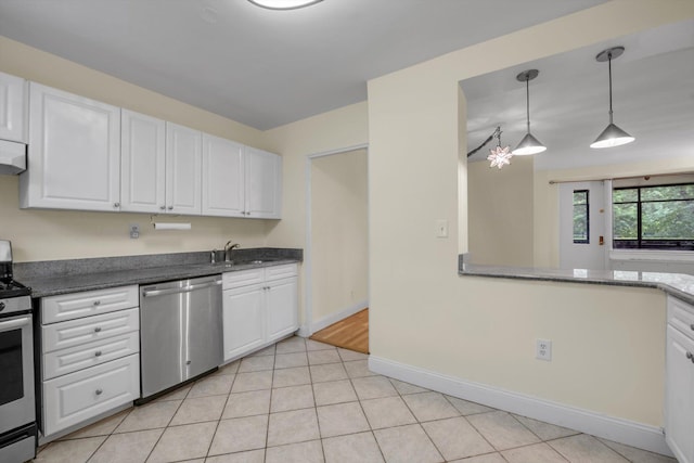 4705 Henry Hudson Pkwy W Unit 1J, Bronx, NY 10471 - kitchen with appliances with stainless steel finishes, white cabinetry, decorative light fixtures, light tile patterned floors, and extractor fan