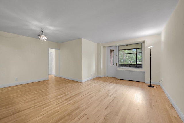 4705 Henry Hudson Pkwy W Unit 1J, Bronx, NY 10471 - unfurnished room featuring light wood-type flooring and a chandelier