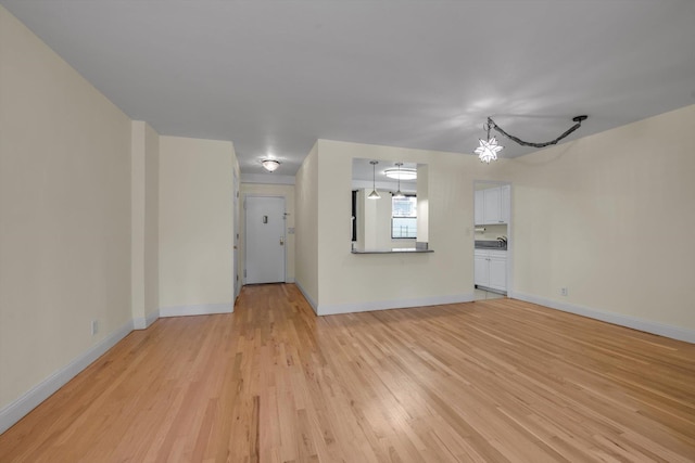 4705 Henry Hudson Pkwy W Unit 1J, Bronx, NY 10471 - unfurnished living room featuring light wood-style floors and baseboards