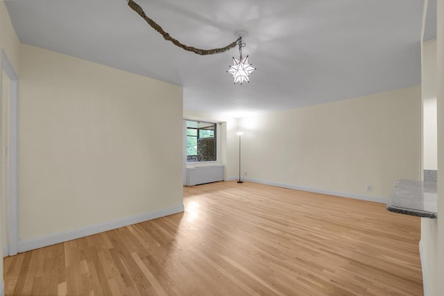 4705 Henry Hudson Pkwy W Unit 1J, Bronx, NY 10471 - unfurnished living room with light wood-style floors and baseboards