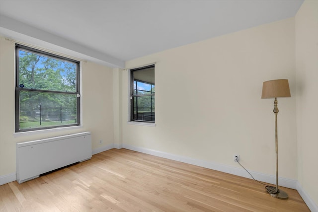 4705 Henry Hudson Pkwy W Unit 1J, Bronx, NY 10471 - empty room with light wood finished floors and radiator