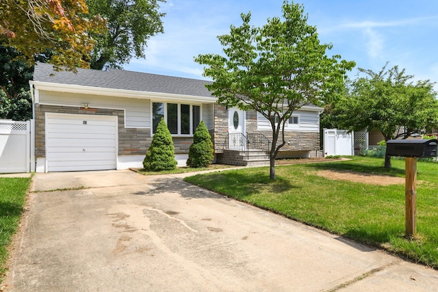 43 Walton St, Brentwood, NY 11717 - view of front facade featuring stone siding, a garage, and driveway