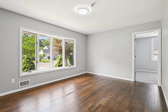 43 Walton St, Brentwood, NY 11717 - spare room with dark wood-style floors