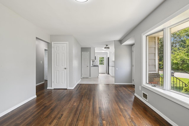 43 Walton St, Brentwood, NY 11717 - unfurnished living room with wood-type flooring and baseboards