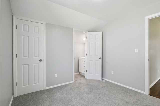 43 Walton St, Brentwood, NY 11717 - unfurnished bedroom with vaulted ceiling, carpet flooring, and ensuite bathroom