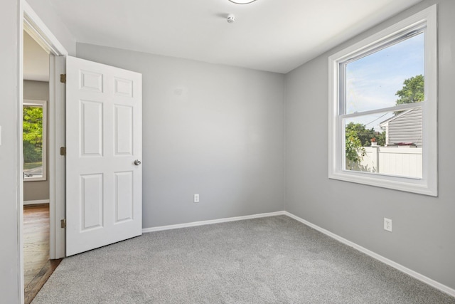 43 Walton St, Brentwood, NY 11717 - spare room with a smoke detector and carpet floors