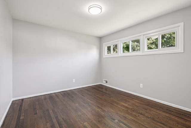 43 Walton St, Brentwood, NY 11717 - spare room featuring baseboards and dark wood finished floors