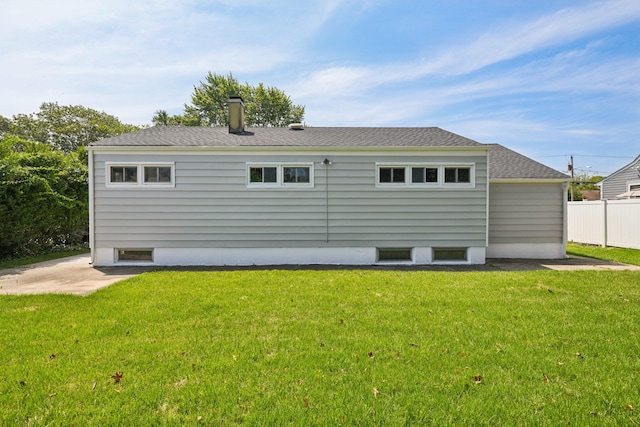 43 Walton St, Brentwood, NY 11717 - rear view of house with a shingled roof