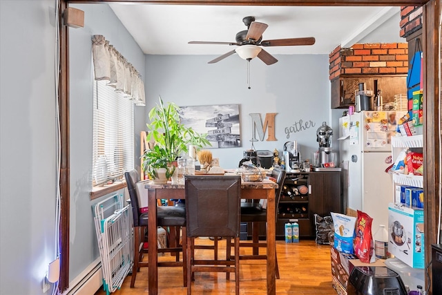 51-23 71st St, Woodside, NY 11377 - dining room featuring a ceiling fan and wood finished floors