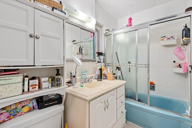 51-23 71st St, Woodside, NY 11377 - full bathroom with vanity, bath / shower combo with glass door, and tasteful backsplash