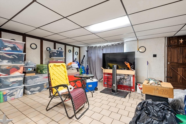51-23 71st St, Woodside, NY 11377 - finished below grade area featuring a paneled ceiling and tile patterned floors