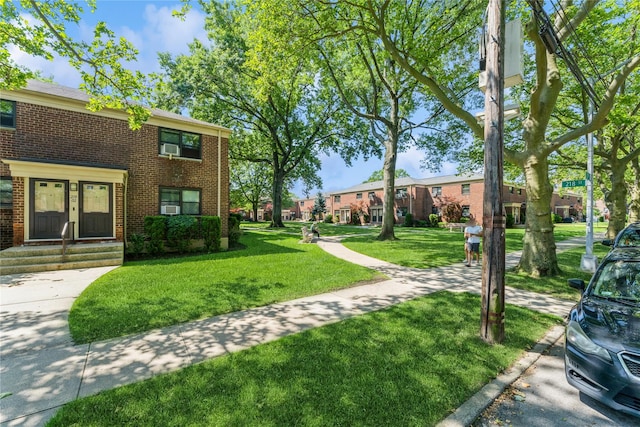 217-22 73rd Ave Upper, Upper, Oakland Gardens, NY 11364 - view of home's community featuring a yard and entry steps