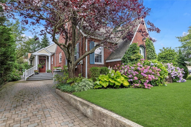 550 Nassau Blvd, West Hempstead, NY 11552 - view of front of property with brick siding and a front lawn
