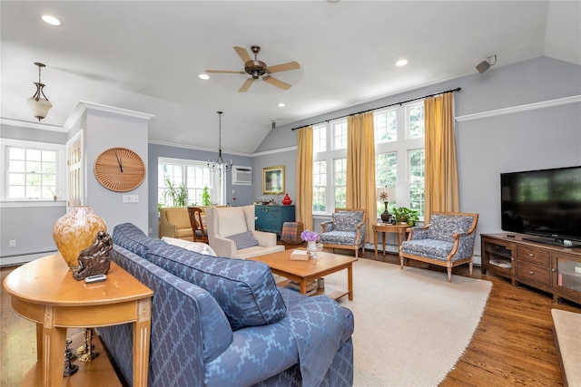 550 Nassau Blvd, West Hempstead, NY 11552 - living room featuring vaulted ceiling, a ceiling fan, healthy amount of natural light, wood finished floors, and crown molding