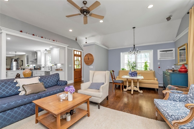 550 Nassau Blvd, West Hempstead, NY 11552 - living area with lofted ceiling, ceiling fan, an AC wall unit, healthy amount of natural light, and wood finished floors