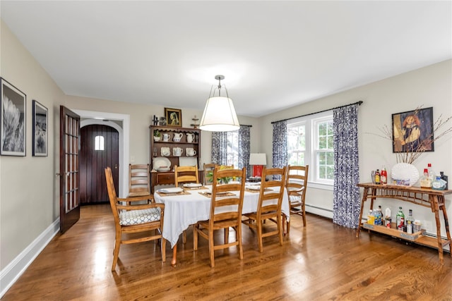 550 Nassau Blvd, West Hempstead, NY 11552 - dining room with wood finished floors and a baseboard radiator