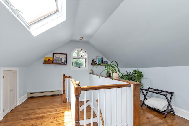 550 Nassau Blvd, West Hempstead, NY 11552 - office area with baseboard heating, wood finished floors, a skylight, and vaulted ceiling