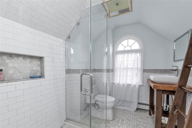 550 Nassau Blvd, West Hempstead, NY 11552 - full bath featuring tile walls, lofted ceiling, a baseboard radiator, vanity, and a stall shower