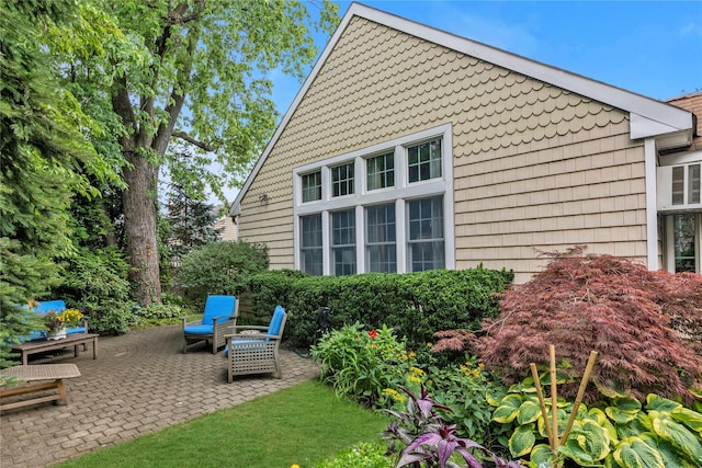 550 Nassau Blvd, West Hempstead, NY 11552 - view of side of property featuring a patio