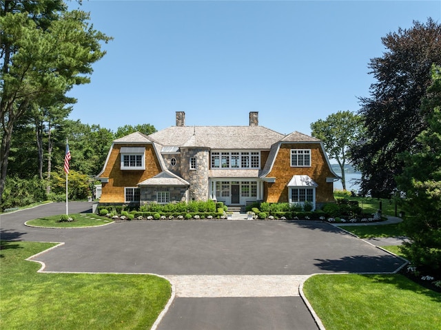 12 N Rd, Laurel Hollow, NY 11771 - shingle-style home with a chimney, a gambrel roof, and stone siding