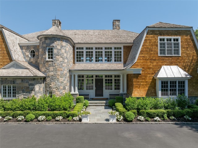 12 N Rd, Laurel Hollow, NY 11771 - shingle-style home with a porch, a chimney, stone siding, and a standing seam roof