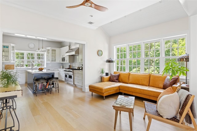 12 N Rd, Laurel Hollow, NY 11771 - living area with a ceiling fan, vaulted ceiling, healthy amount of natural light, light wood-type flooring, and crown molding