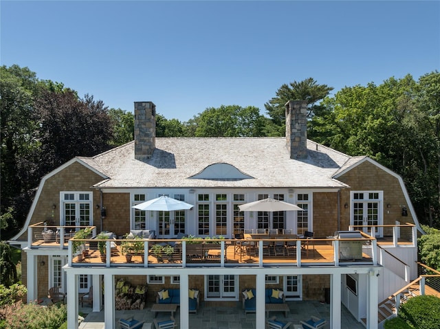 12 N Rd, Laurel Hollow, NY 11771 - rear view of property with french doors, a chimney, a patio, and a gambrel roof