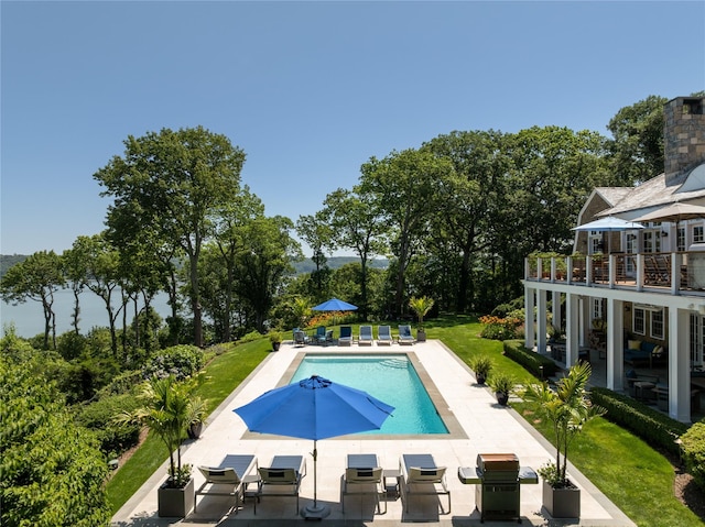 12 N Rd, Laurel Hollow, NY 11771 - swimming pool featuring area for grilling, a patio area, and a lawn