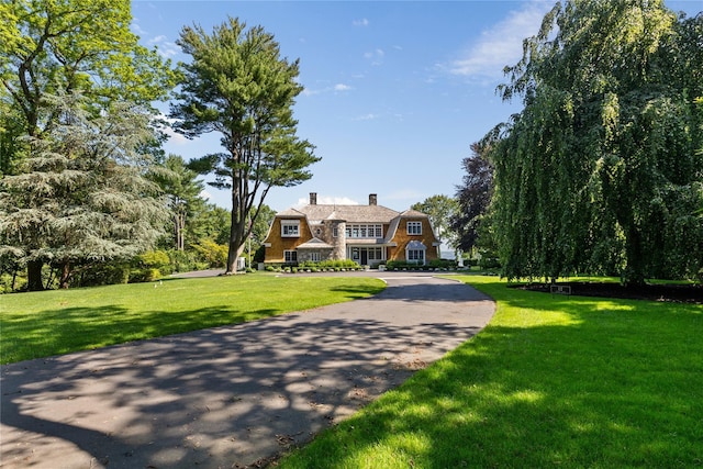 12 N Rd, Laurel Hollow, NY 11771 - shingle-style home with a chimney, a front yard, and a gambrel roof