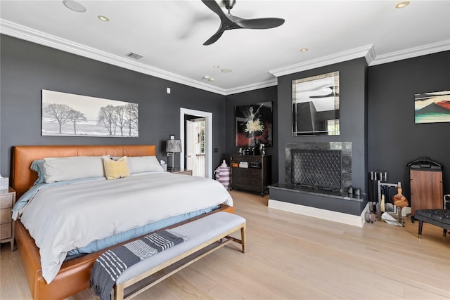 12 N Rd, Laurel Hollow, NY 11771 - bedroom with crown molding, wood finished floors, a premium fireplace, recessed lighting, and a ceiling fan