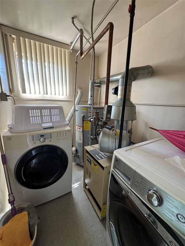 33-42 150th St, Flushing, NY 11354 - laundry room featuring gas water heater and independent washer and dryer