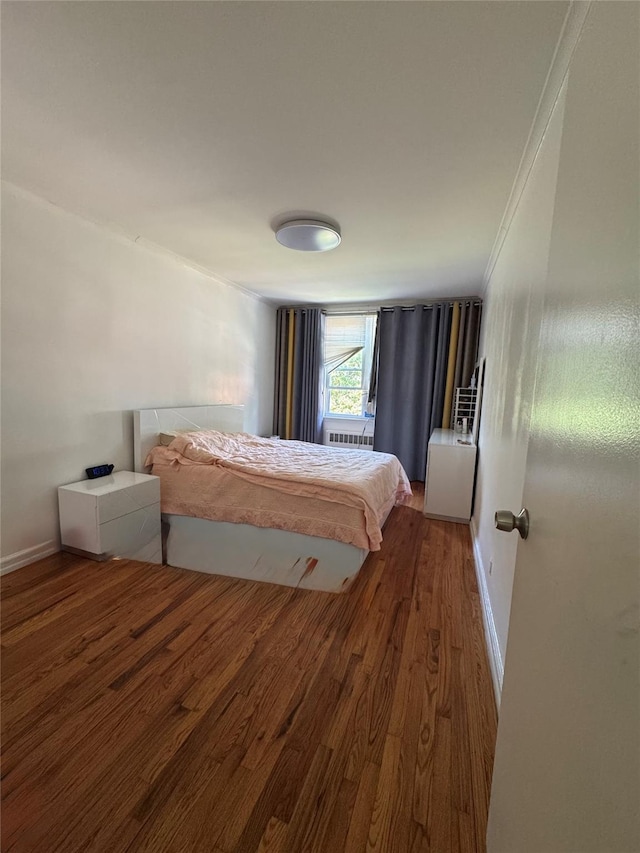 33-42 150th St, Flushing, NY 11354 - bedroom featuring wood finished floors and baseboards