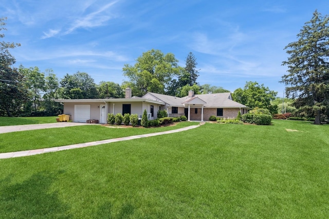 2 Foxwood Rd, Kings Point, NY 11024 - ranch-style house with a chimney, an attached garage, concrete driveway, and a front lawn