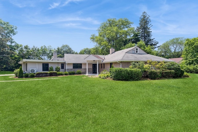 2 Foxwood Rd, Kings Point, NY 11024 - ranch-style house with a chimney and a front lawn