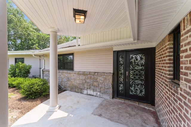 2 Foxwood Rd, Kings Point, NY 11024 - doorway to property with stone siding