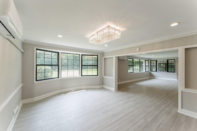 2 Foxwood Rd, Kings Point, NY 11024 - unfurnished room featuring a wall mounted air conditioner, light wood-type flooring, a chandelier, crown molding, and recessed lighting