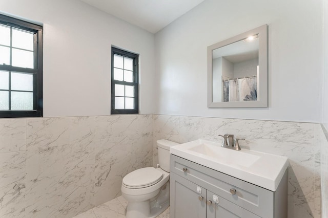 2 Foxwood Rd, Kings Point, NY 11024 - full bath featuring tile walls, vanity, marble finish floors, and wainscoting