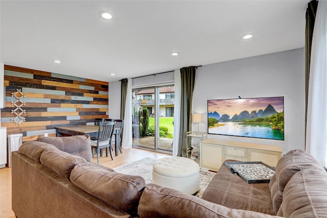 1 Anchorage Way Unit 301, Freeport, NY 11520 - living area featuring light wood finished floors, recessed lighting, and wooden walls