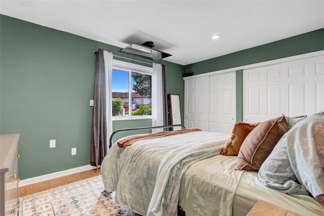 1 Anchorage Way Unit 301, Freeport, NY 11520 - bedroom with light wood-style floors and recessed lighting