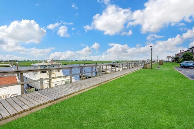1 Anchorage Way Unit 301, Freeport, NY 11520 - dock area featuring a lawn and boat lift