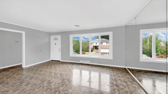 107 Croydon Rd, Yonkers, NY 10710 - unfurnished living room with plenty of natural light, crown molding, and tile patterned floors