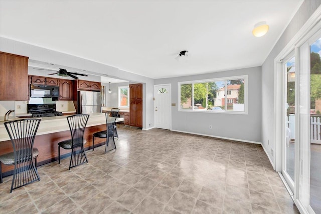 107 Croydon Rd, Yonkers, NY 10710 - kitchen featuring black appliances, a ceiling fan, light countertops, and a peninsula