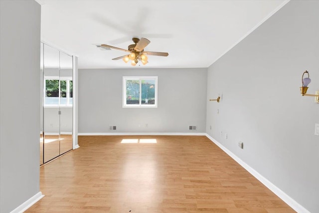 107 Croydon Rd, Yonkers, NY 10710 - unfurnished bedroom featuring multiple windows, light wood finished floors, and ceiling fan