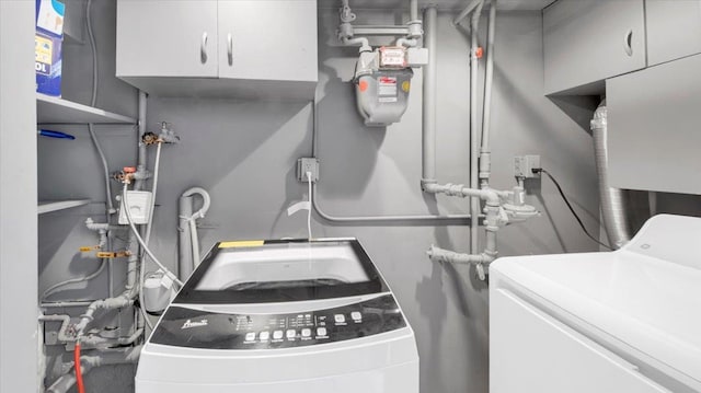 107 Croydon Rd, Yonkers, NY 10710 - laundry area with cabinet space and washing machine and clothes dryer
