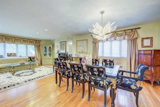 7015 170th St, Fresh Meadows, NY 11365 - dining room with wood finished floors, a chandelier, and recessed lighting