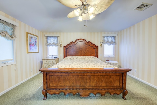 7015 170th St, Fresh Meadows, NY 11365 - bedroom with multiple windows, wallpapered walls, light carpet, and a ceiling fan