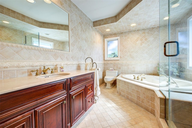7015 170th St, Fresh Meadows, NY 11365 - bathroom with tile walls, tile patterned flooring, a garden tub, vanity, and tiled shower